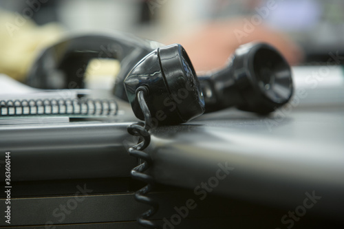 close-up of telephone receiver on table at office photo