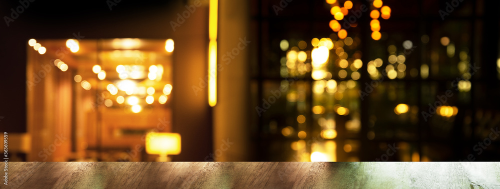 top of wood table with blur bar or pub with night party orange light city interior banner background - obrazy, fototapety, plakaty 