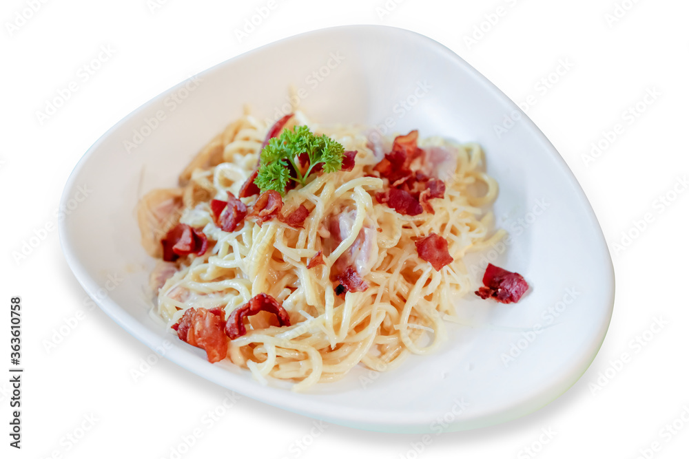 Spaghetti Bacon Carbonara in white plate on white isolated.