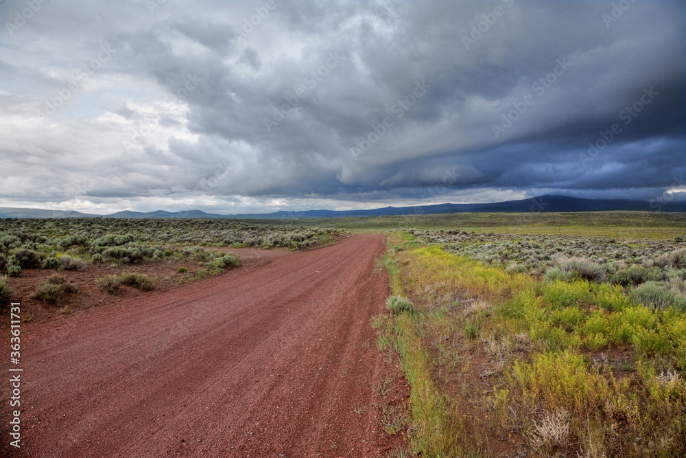 A desert road constructed of red volcanic cinders, east of Bend, Oregon.