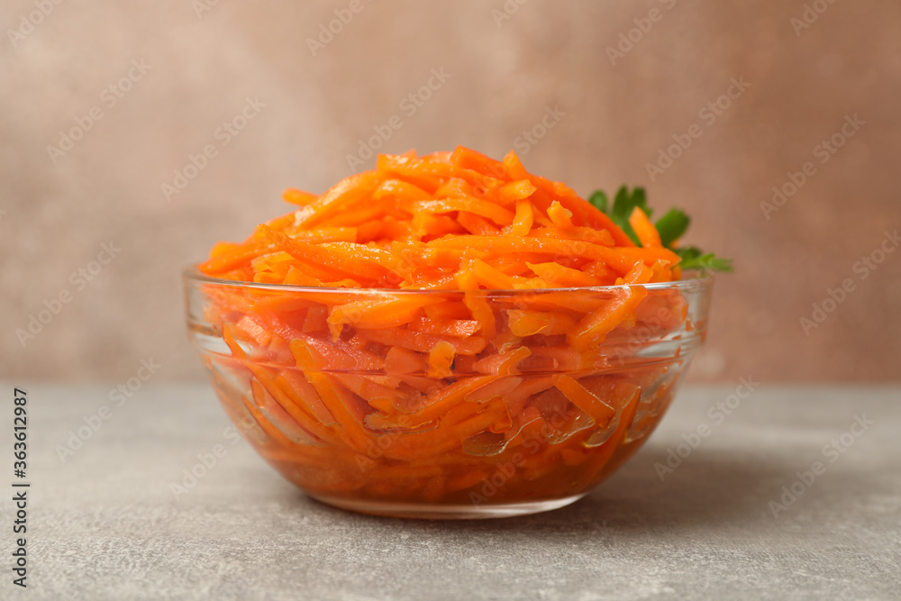 Tasty carrot salad on gray background, close up Tasty carrot salad on gray background, close up