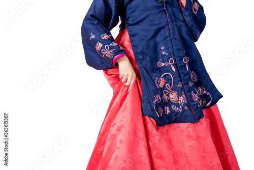 Woman wearing a traditional Hanbok, which is a Korean national costume, with her handles on the skirt, On white isolated background