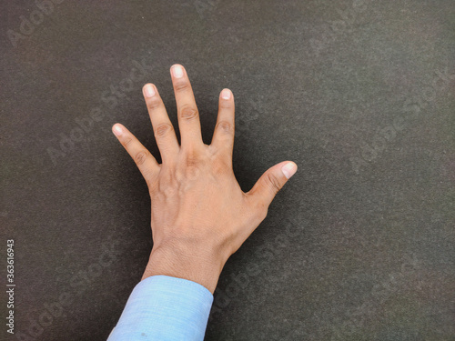 Single open hand Isolated backside view with stretched fingers showing counting gesture five , Education concept, stop sign.