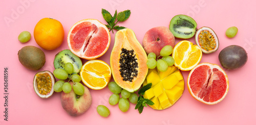 Summer fruits backround. Various fruits on pink background. Summer concept. Banner.