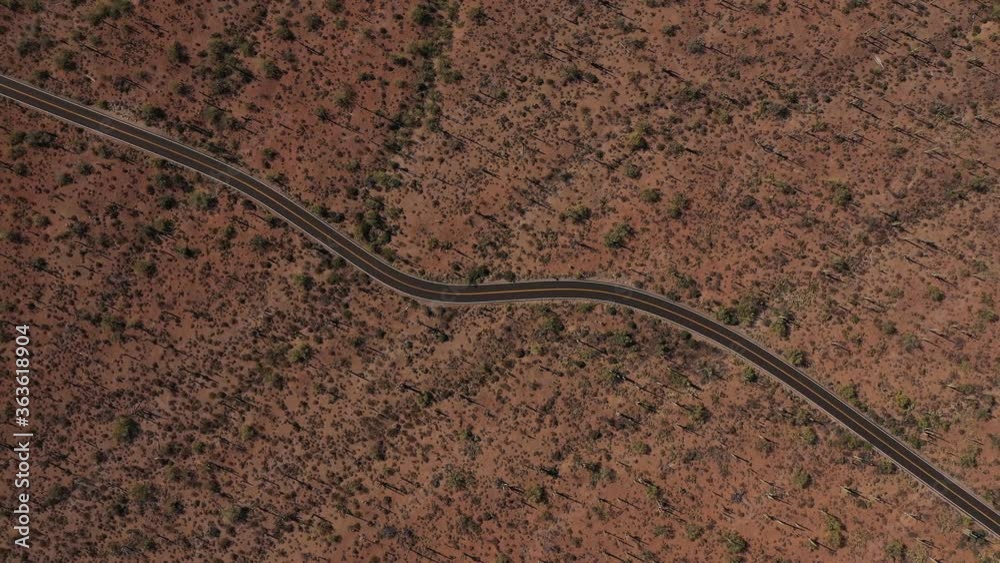 Aerial straight down top down of a lonely empty mountain road. Aerial straight down top down of a lonely empty mountain road.