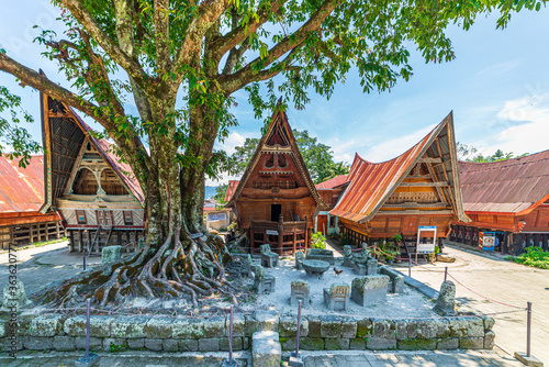 Batak traditional houses in a row at Ambarita village, lake Toba, travel destination in Sumatra, Indonesia. photo