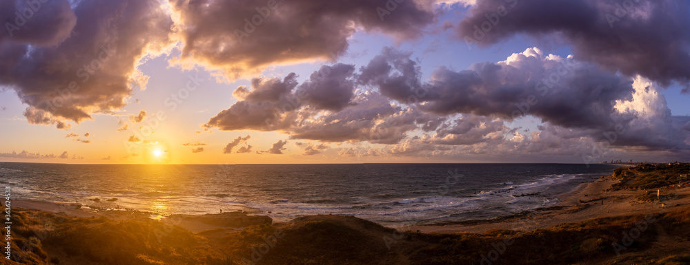 Sunset clouds on sea beach of romantic vacation