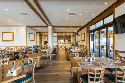 Interior of a hotel restaurant with wooden furniture