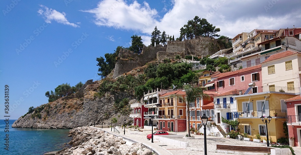 Parga, Greece with the castle and the sea front with colourfull houses and buildings