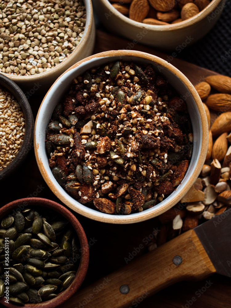 Traditional whole foods, grains, nuts and seeds in rustic, natural light setting with custom made cermics. Traditional whole foods, grains, nuts and seeds in rustic, natural light setting with custom made cermics.