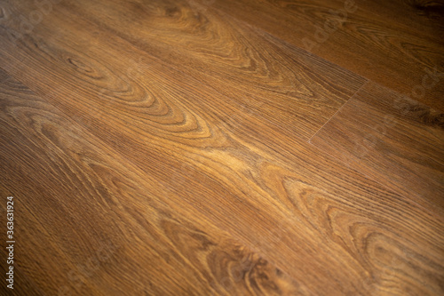 Wood laminate flooring texture background. Dark wooden textured luxury interior floor. © Joao