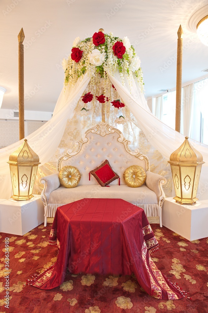 The interior is in oriental style. Decoration for henna party