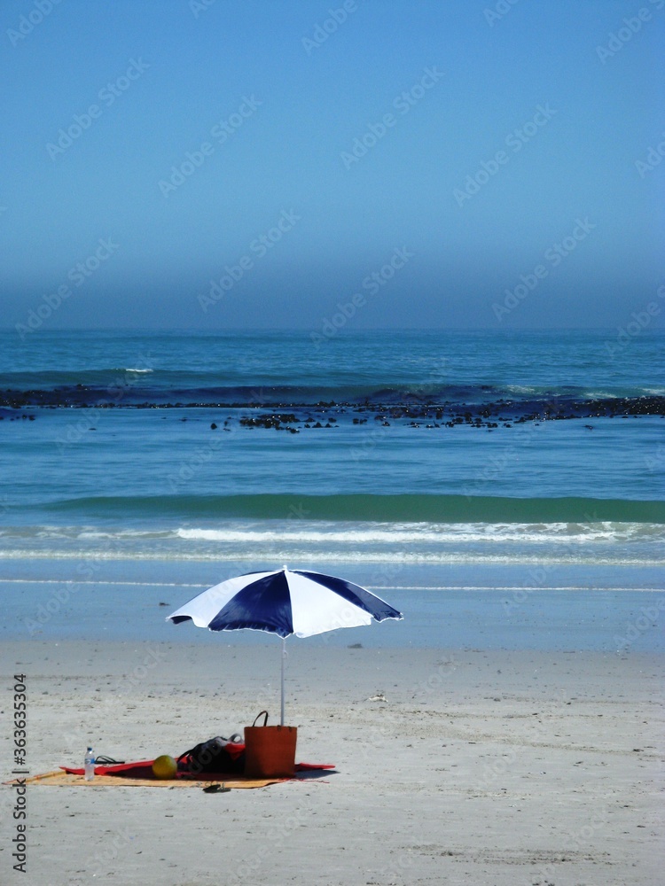 umbrella on the beach with picnic mat 