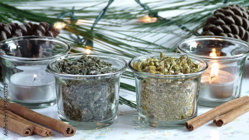 Dried Herbs with, Candles, Cinnamon Sticks, Pine Branches and Mini Lights | Winter Herb Scene