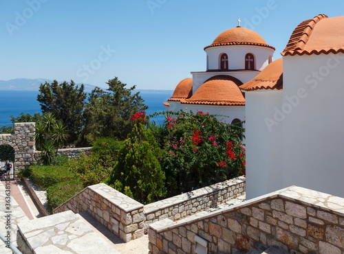 Monastery of Agios Savvas located on top of a hill above Pothia Town, the capital of Kalymnos, Dodecanese, Greece photo