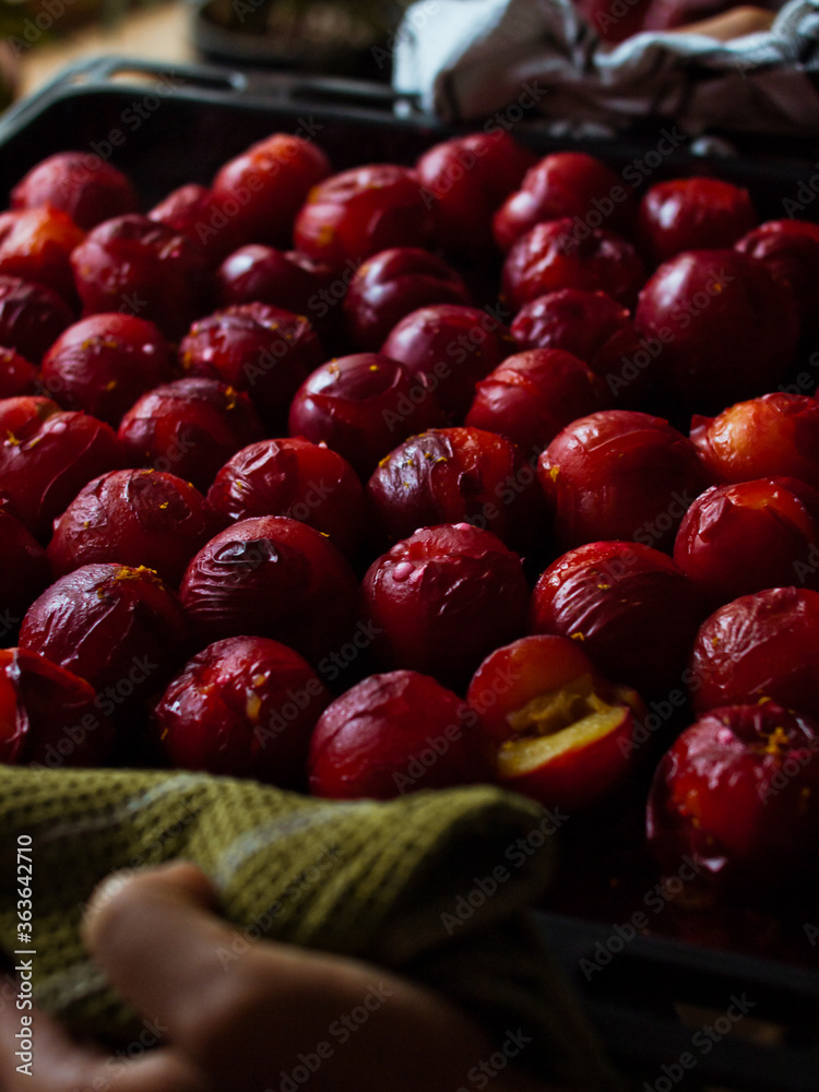 Roasted red plums just out of the oven Roasted red plums just out of the oven