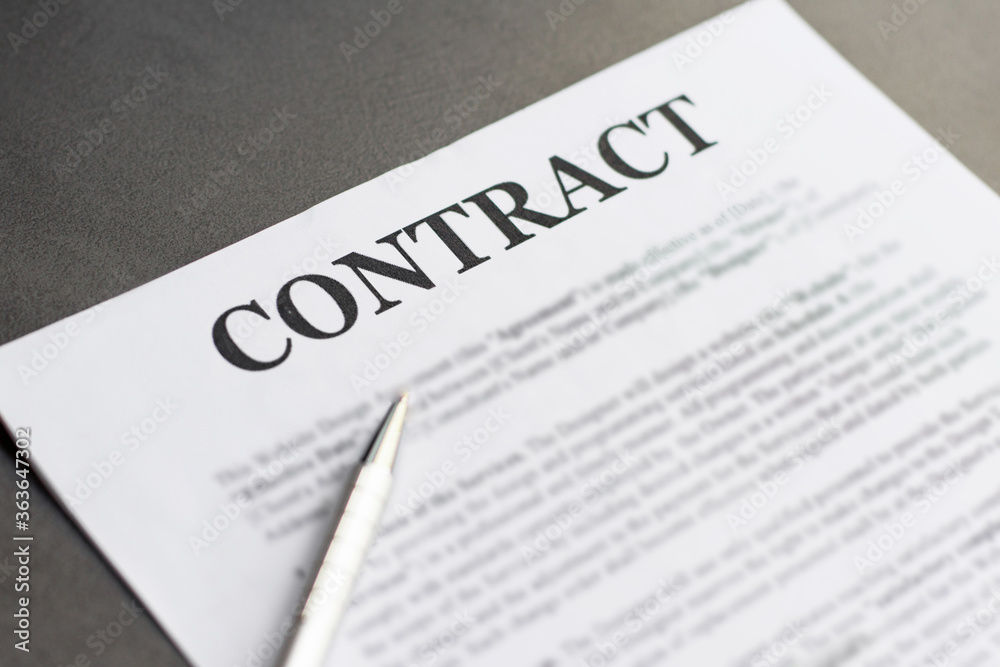 Business Contract and pen close up on grey background Business Contract and pen close up on grey background
