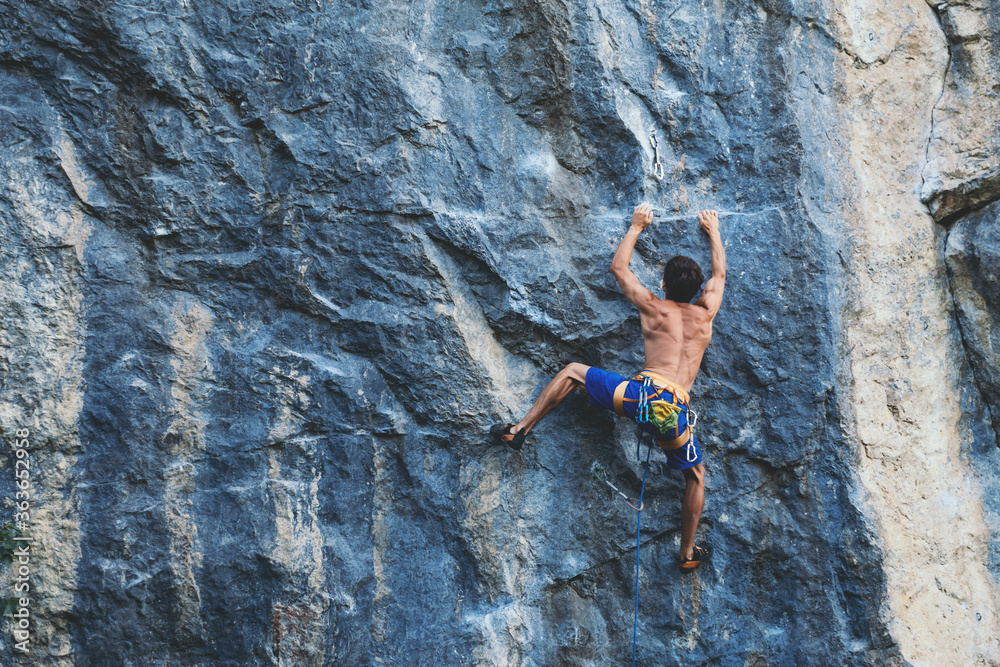 Man climbs a rock.