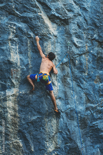 Man climbs a rock.