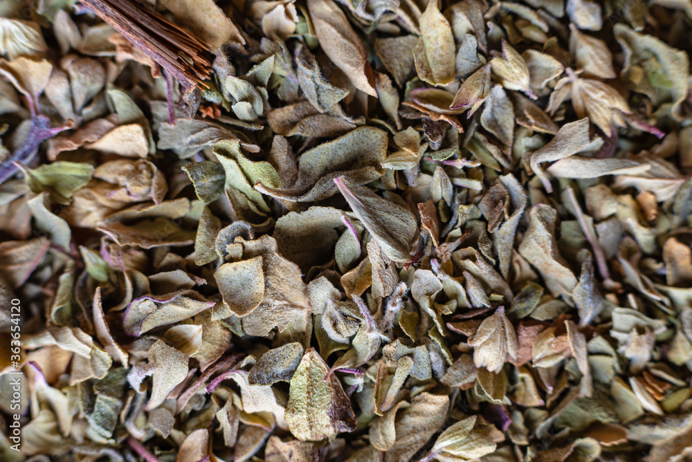 Fullscreen macro closeup of dried oregano. Food seasoning. Texture. Graphic design. Fullscreen macro closeup of dried oregano. Food seasoning. Texture. Graphic design.
