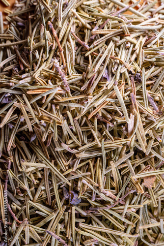 Closeup of dried rosemary leaves. Rosemary texture. Very popular and healthy seasoning worldwide.