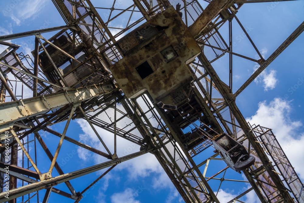 old metal tower crane in a steelworks