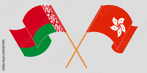 Crossed and waving flags of Belarus and Hong Kong