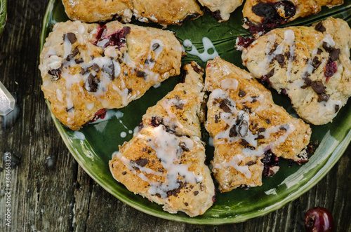 Cranberry & Cherry Scones. Baking on an old wooden table in rustic style.