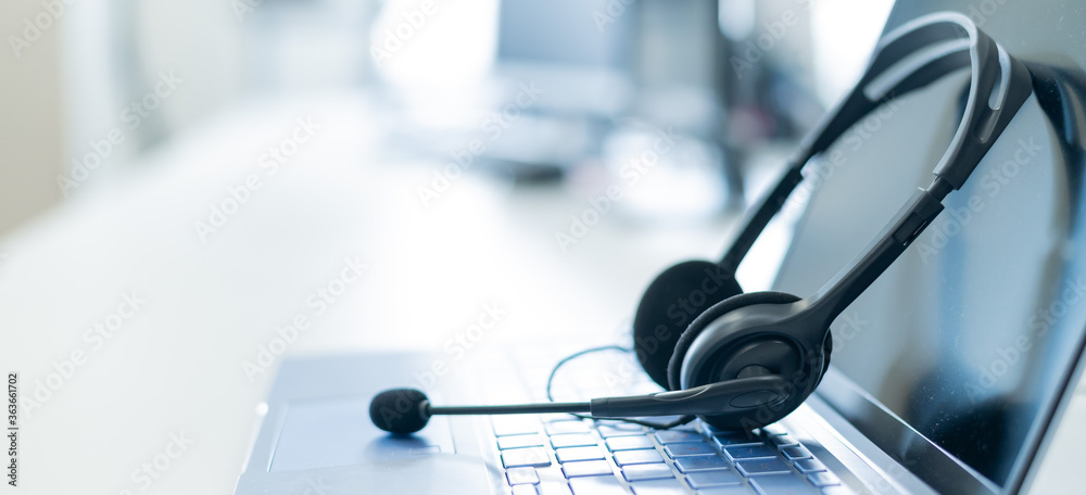 © Михаил Решетников - Call center operator desktop. Close-up of a headset on a laptop. Help desk. Workplace of a support service employee. Headphones with a microphone for voip on a computer keyboard. © Михаил Решетников - Call center operator desktop. Close-up of a headset on a laptop. Help desk. Workplace of a support service employee. Headphones with a microphone for voip on a computer keyboard.