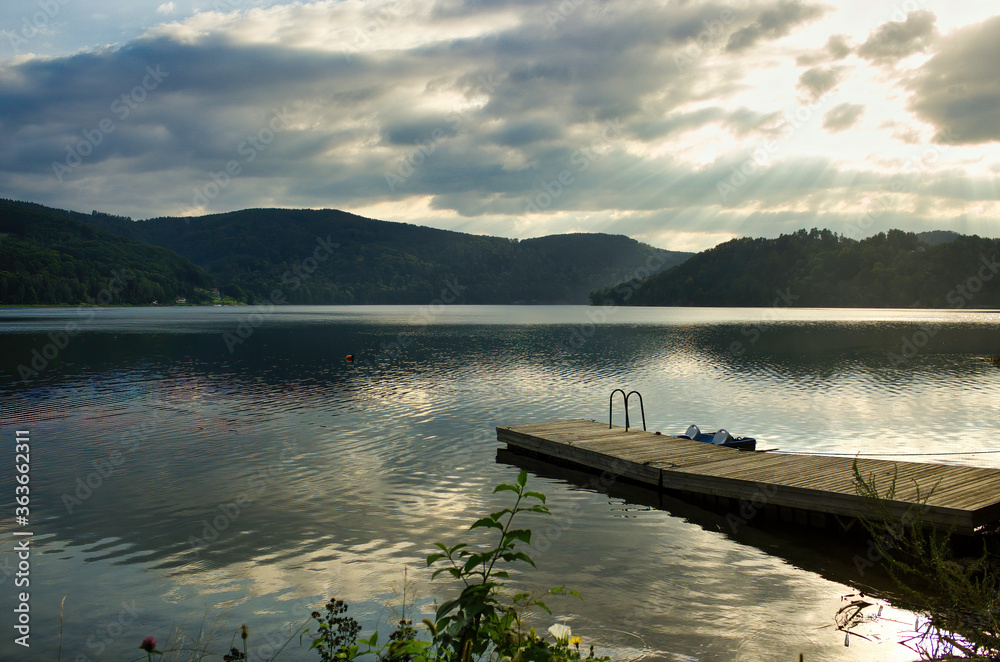 A wide angle view of Roznowskie lake against dramatic sky located in South Poland, Europe