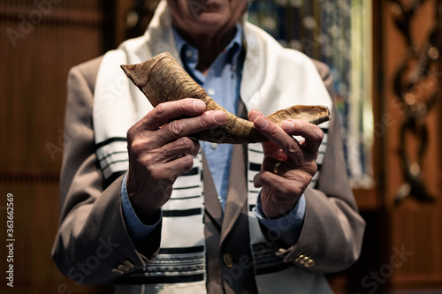 Synagogue: Senior Man Ready To Blow Shofar During Service photo