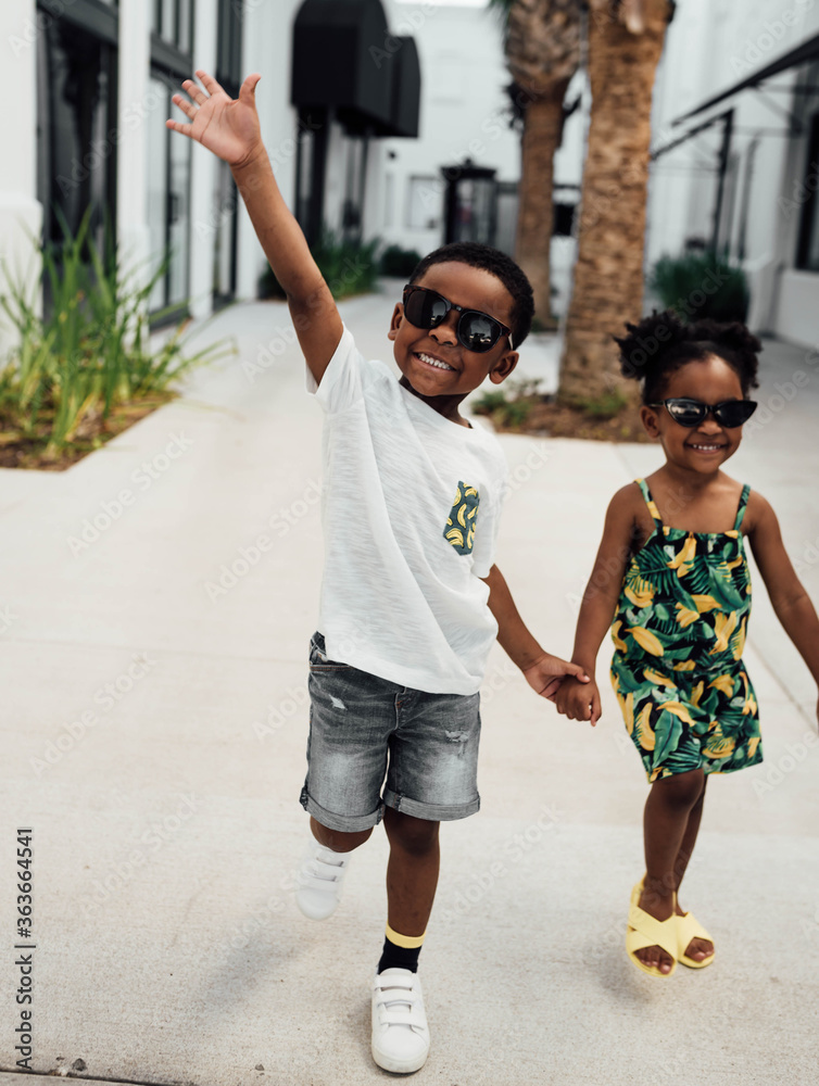Brother and Sister holding hands running Stock Photo | Adobe Stock
