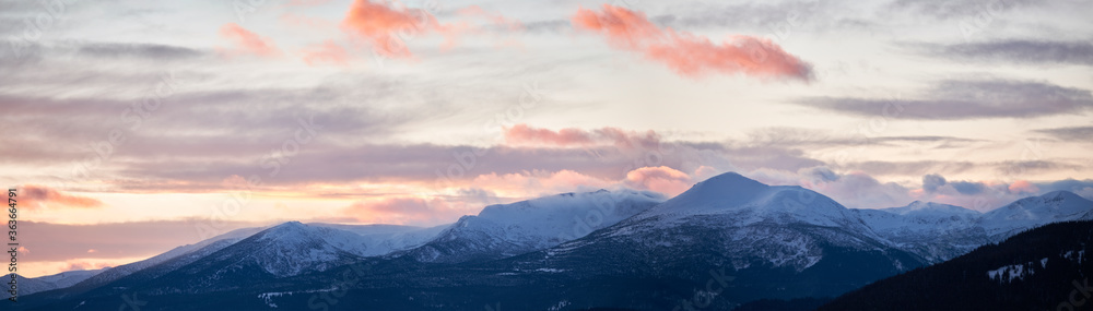 Cloudy sky over snowy mountains