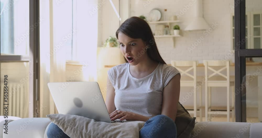 Reading Computer Amazed Excited young woman using laptop feel amazed read great online news ...