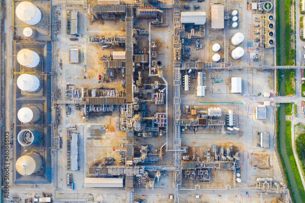 Top view of oil refinery plant chemical factory and power plant with many storage tanks and pipelines in industrial estate