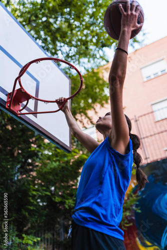 woman with basket ball in court photo