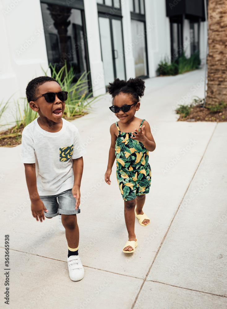 Brother and Sister holding hands running Stock Photo | Adobe Stock