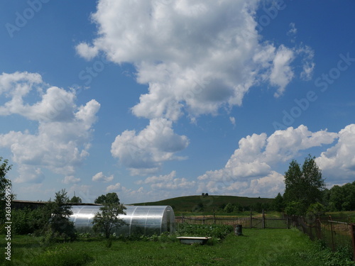 counryside and blue sky with clouds photo