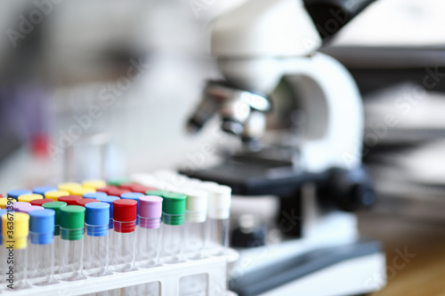 Empty blood collection flasks stand in laboratory