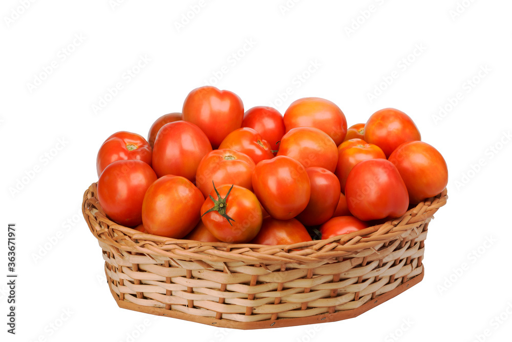 tomatoes in wicker basket on isolated white background tomatoes in wicker basket on isolated white background
