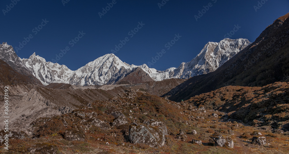 Cheo Himal & Himlung Himal stunning summits on Nepal-Tibet border as seen on descent from Larkya La pass to Bimtang village, Manaslu Circuit trek, Manaslu Himal, Gorkha district, Nepal Himalaya. Cheo Himal & Himlung Himal stunning summits on Nepal-Tibet border as seen on descent from Larkya La pass to Bimtang village, Manaslu Circuit trek, Manaslu Himal, Gorkha district, Nepal Himalaya.