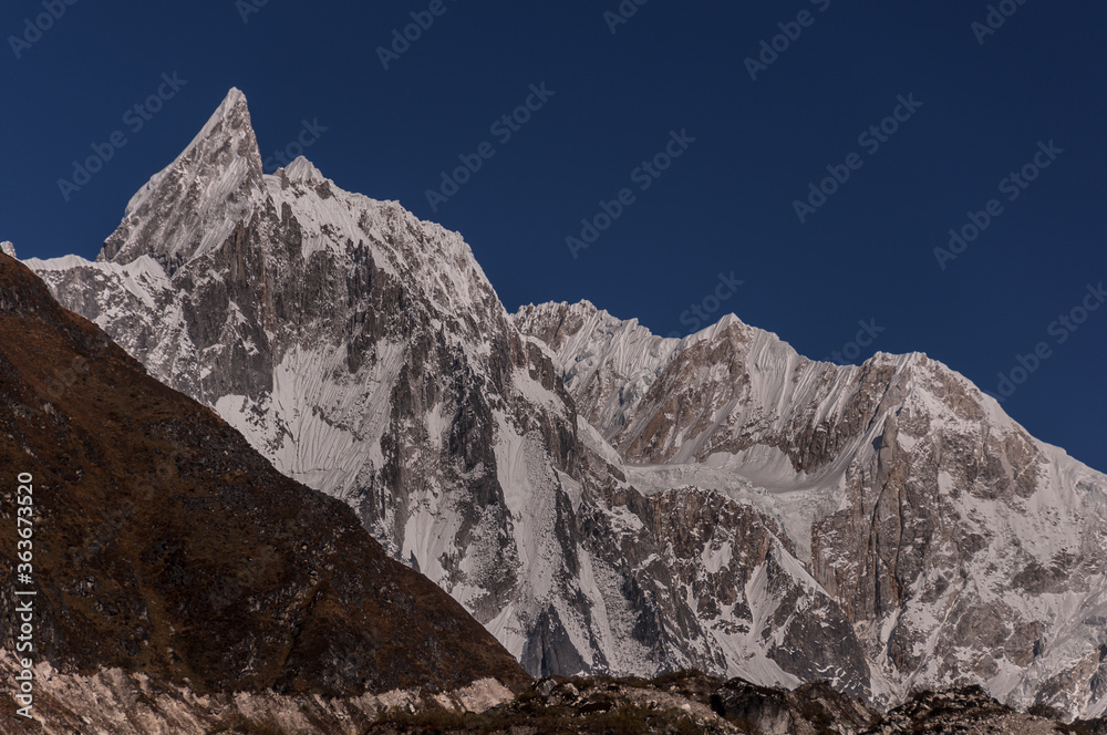 Cheo Himal & Himlung Himal stunning summits on Nepal-Tibet border as seen on descent from Larkya La pass to Bimtang village, Manaslu Circuit trek, Manaslu Himal, Gorkha district, Nepal Himalaya. Cheo Himal & Himlung Himal stunning summits on Nepal-Tibet border as seen on descent from Larkya La pass to Bimtang village, Manaslu Circuit trek, Manaslu Himal, Gorkha district, Nepal Himalaya.