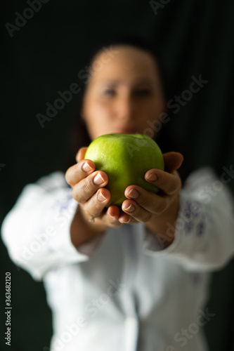 doctor with a green apple