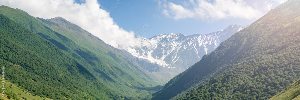 Mountain landscape with green meadow. Mountains valley panorama of Caucasus