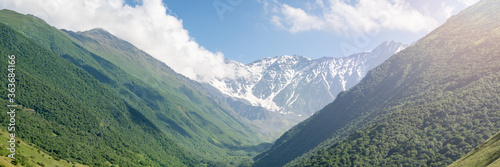 Mountain landscape with green meadow. Mountains valley panorama of Caucasus © Leonid