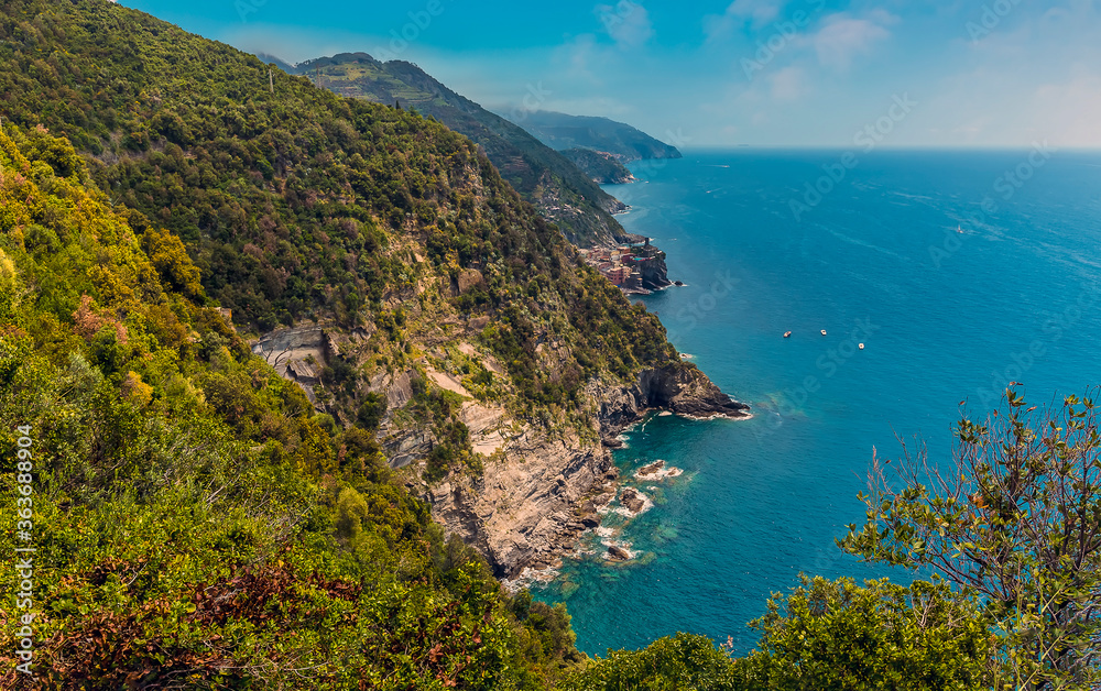 A view from the Monterosso to Vernazza path towards Vernazza in the summertime