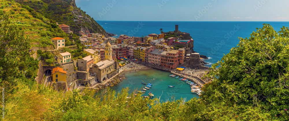 A panorama view looking over the Cinque Terre village of Vernazza in the summertime