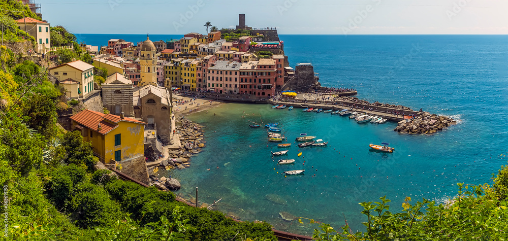 A view over the picturesque village and harbour of Vernazza in the summertime