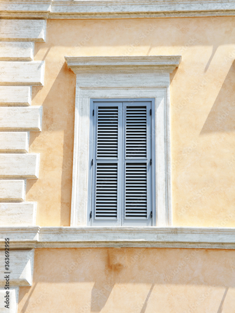 Old Italian (Rome) window. Blue wooden  shutter windows.