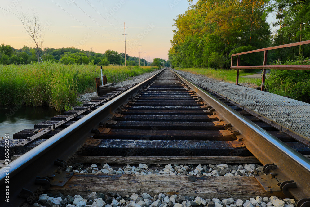 American railroad tracks in countryside 